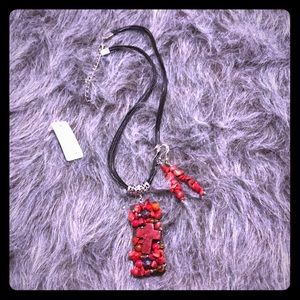 Ladies Red stone cross necklace and earrings